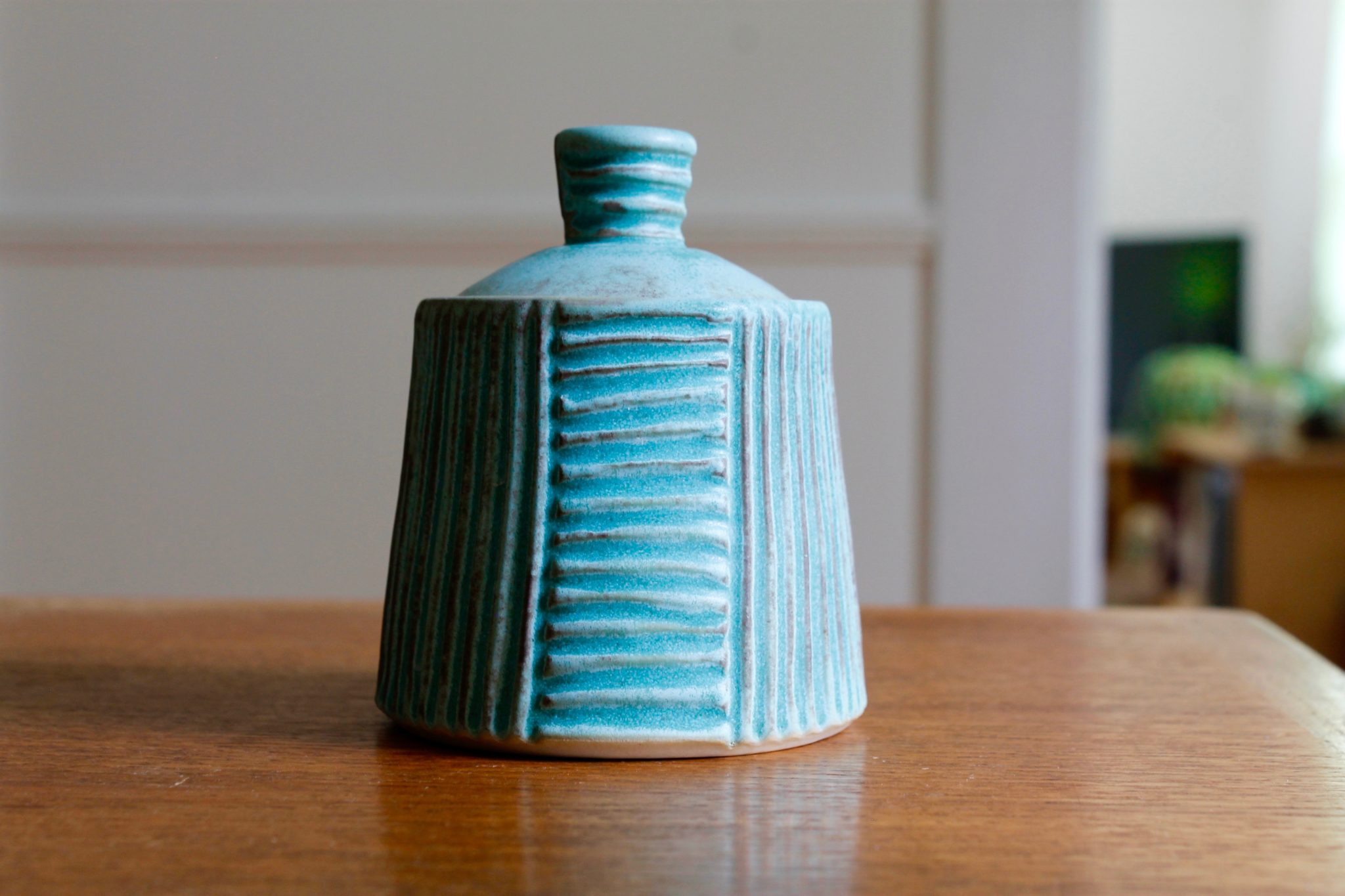 Turquoise pottery honey pot
